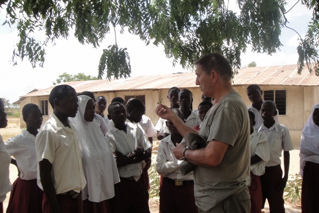 Paul Keeley from Sustainable Global Gardens at Mwanda Primary School giving a lesson on the pesticidal value of Neem