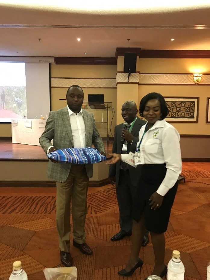 ICPP2 was opened by the Honourable Deputy Minister of Agriculture of Zimbabwe, seen here receiving a gift of thanks